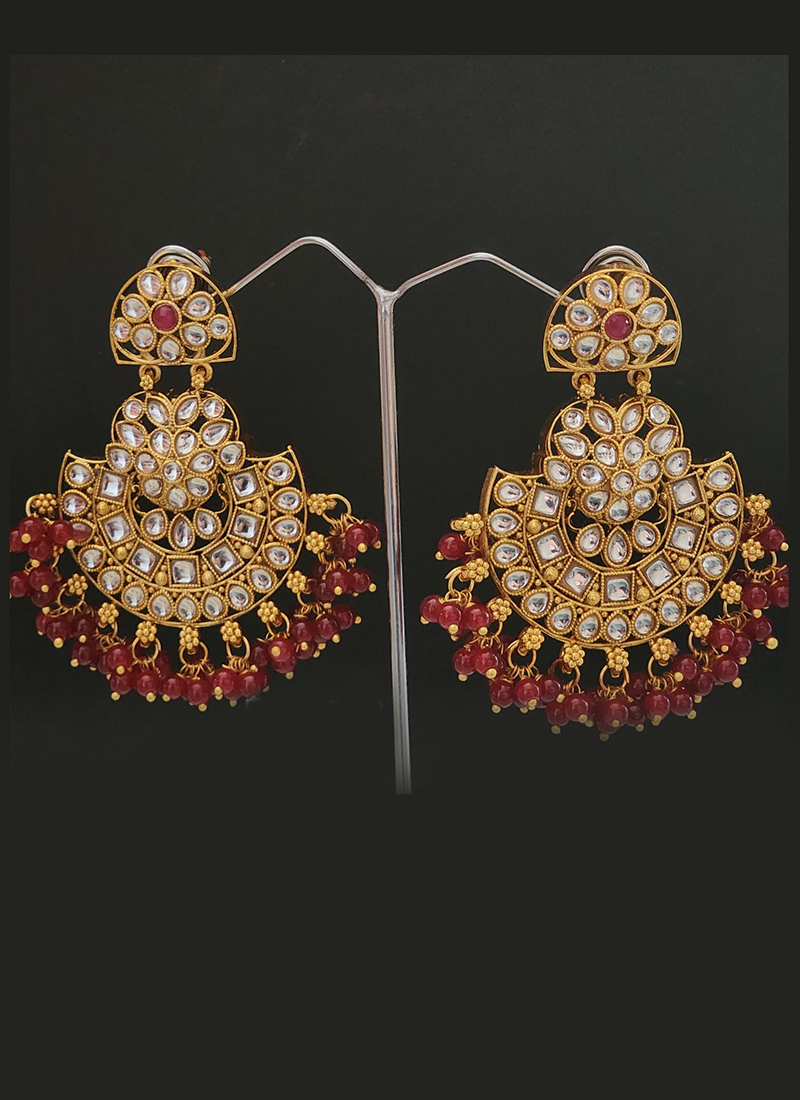 Maroon colour jhumka earrings and tikka set with pipal Patti in tradit –  Timeless desires collection