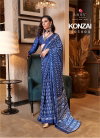 Konzai By Rajtex Blue Colour Patola Printed Satin Crepe Saree Wholesale In India